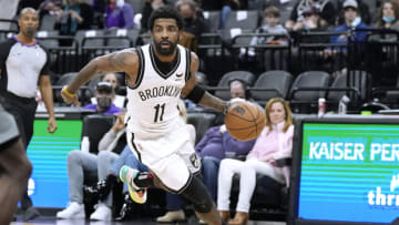 SACRAMENTO, CALIFORNIA - FEBRUARY 02: Kyrie Irving #11 of the Brooklyn Nets dribbling the ball drives towards the basket against the Sacramento Kings during the second half of an NBA basketball game at Golden 1 Center on February 02, 2022 in Sacramento, California. NOTE TO USER: User expressly acknowledges and agrees that, by downloading and or using this photograph, User is consenting to the terms and conditions of the Getty Images License Agreement. (Photo by Thearon W. Henderson/Getty Images)
