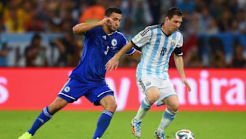 RIO DE JANEIRO, BRAZIL - JUNE 15: Lionel Messi of Argentina dribbles past Sead Kolasinac of Bosnia and Herzegovina during the 2014 FIFA World Cup Brazil Group F match between Argentina and Bosnia-Herzegovina at Maracana on June 15, 2014 in Rio de Janeiro, Brazil. (Photo by Matthias Hangst/Getty Images)