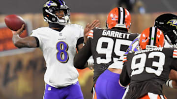 CLEVELAND, OHIO - DECEMBER 14: Lamar Jackson #8 of the Baltimore Ravens attempts a pass during the first quarter against the Cleveland Browns in the game at FirstEnergy Stadium on December 14, 2020 in Cleveland, Ohio. (Photo by Jason Miller/Getty Images)
