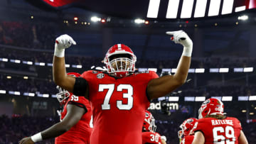 INGLEWOOD, CALIFORNIA - JANUARY 09: Xavier Truss #73 of the Georgia Bulldogs celebrates with teammates after a touchdown in the first quarter against the TCU Horned Frogs in the College Football Playoff National Championship game at SoFi Stadium on January 09, 2023 in Inglewood, California. (Photo by Ronald Martinez/Getty Images)