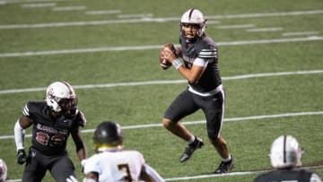 Alabama A&M quarterback Aqeel Glass (4) looks to pass against Alabama State University during the Magic City Classic at Legion Field in Birmingham, Ala., on Saturday April 17, 2021.Magic46