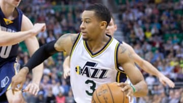 Feb 4, 2015; Salt Lake City, UT, USA; Utah Jazz guard Trey Burke (3) dribbles the ball during the second half against the Memphis Grizzlies at EnergySolutions Arena. Memphis won 100-90. Mandatory Credit: Russ Isabella-USA TODAY Sports