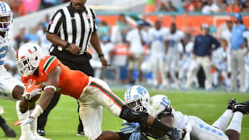 Oct 15, 2016; Miami Gardens, FL, USA; North Carolina Tar Heels linebacker Andre Smith (10) brings down Miami Hurricanes wide receiver Stacy Coley (3) during the second half at Hard Rock Stadium. The North Carolina Tar Heels defeat the Miami Hurricanes 20-13. Mandatory Credit: Jasen Vinlove-USA TODAY Sports
