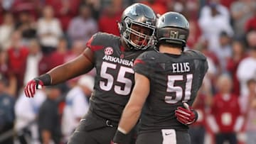 Nov 5, 2016; Fayetteville, AR, USA; Arkansas Razorbacks defensive lineman Jeremiah Ledbetter (55) celebrates with linebacker Brooks Ellis (51) after a sack against the Florida Gators at Donald W. Reynolds Razorback Stadium. Arkansas defeated Florida 31-10. Mandatory Credit: Nelson Chenault-USA TODAY Sports