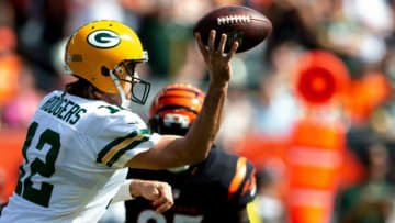 Green Bay Packers quarterback Aaron Rodgers (12) throws a pass as Cincinnati Bengals defensive tackle Larry Ogunjobi (65) pressures him in the first half of the NFL football game between the Cincinnati Bengals and the Green Bay Packers on Sunday, Oct. 10, 2021, at Paul Brown Stadium in Cincinnati.Green Bay Packers At Cincinnati Bengals 40