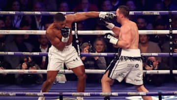 CARDIFF, WALES - MARCH 31: Anthony Joshua punches Joseph Parker during there WBA, IBF, WBO & IBO Heavyweight Championship title fight at Principality Stadium on March 31, 2018 in Cardiff, Wales. (Photo by Julian Finney/Getty Images)