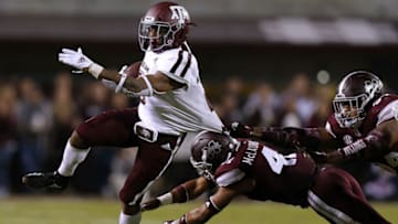 STARKVILLE, MS - OCTOBER 27: Trayveon Williams #5 of the Texas A&M Aggies runs with the ball as Jeffery Simmons #94 and Mark McLaurin #41 of the Mississippi State Bulldogs defend during the second half at Davis Wade Stadium on October 27, 2018 in Starkville, Mississippi. (Photo by Jonathan Bachman/Getty Images)