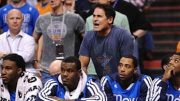 Jan 17, 2014; Phoenix, AZ, USA; Dallas Mavericks owner Mark Cuban yells from the bench in the second half against the Phoenix Suns at US Airways Center. The Mavericks won 110-107. Mandatory Credit: Jennifer Stewart-USA TODAY Sports