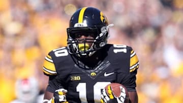 Oct 11, 2014; Iowa City, IA, USA; Iowa Hawkeyes running back Jonathan Parker (10) breaks for a long touch down run against the Indiana Hoosiers at Kinnick Stadium. Mandatory Credit: Reese Strickland-USA TODAY Sports