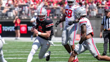 Apr 15, 2023; Columbus, Ohio, United States; Ohio State Buckeyes quarterback Kyle McCord (6) runs the ball through an opening in the Buckeyes defensive line during the third quarter of the Ohio State Buckeyes spring game at Ohio Stadium on Saturday morning. Mandatory Credit: Joseph Scheller-The Columbus DispatchFootball Ceb Osufb Spring Game Ohio State At Ohio State