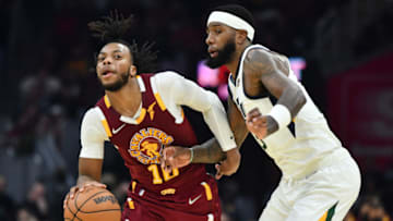 Dec 5, 2021; Cleveland, Ohio, USA; Cleveland Cavaliers guard Darius Garland (10) brings the ball up court against Utah Jazz forward Royce O'Neale (23) during the first half at Rocket Mortgage FieldHouse. Mandatory Credit: Ken Blaze-USA TODAY Sports