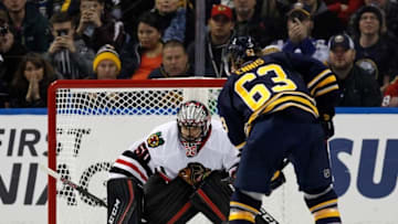 Dec 19, 2015; Buffalo, NY, USA; Buffalo Sabres left wing Tyler Ennis (63) and Chicago Blackhawks goalie Corey Crawford (50) during the game at First Niagara Center. Mandatory Credit: Kevin Hoffman-USA TODAY Sports