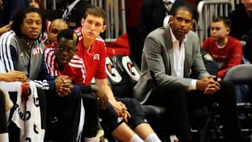 Mar 24, 2014; Atlanta, GA, USA; Injured Atlanta Hawks center Al Horford (15) (gray sports coat) sits on the bench with team mates during the game against the Phoenix Suns during the second half at Philips Arena. The Suns defeated the Hawks 102-95. Mandatory Credit: Dale Zanine-USA TODAY Sports
