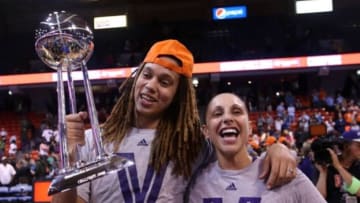 Sep 12, 2014; Chicago, IL, USA; Phoenix Mercury center Brittney Griner (left) and guard Diana Taurasi (right) celebrate with the WNBA championship trophy after defeating the Chicago Sky 87-82 in game three of the 2014 WNBA Finals at UIC Pavilion. Mandatory Credit: Jerry Lai-USA TODAY Sports