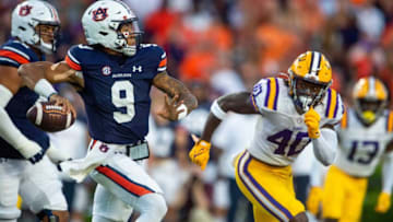 Auburn football quarterback Robby Ashford (9) passes as LSU Tigers linebacker Harold Perkins Jr. (40) closes as the Auburn Tigers take on the LSU Tigers at Jordan-Hare Stadium in Auburn, Ala., on Saturday, Oct. 1, 2022.Aulsu01