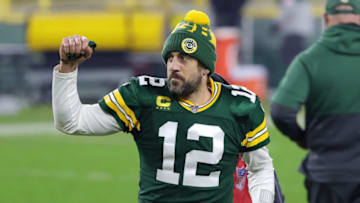 GREEN BAY, WISCONSIN - JANUARY 16: Aaron Rodgers #12 of the Green Bay Packers celebrates defeating the Los Angeles Rams 32-18 in the NFC Divisional Playoff game at Lambeau Field on January 16, 2021 in Green Bay, Wisconsin. (Photo by Stacy Revere/Getty Images)