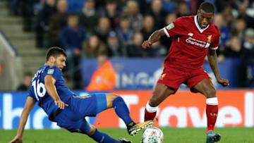 LEICESTER, ENGLAND - SEPTEMBER 19: Aleksander Dragovic of Leicester City tackles Georginio Wijnaldum of Liverpool during the Carabao Cup Third Round match between Leicester City and Liverpool at The King Power Stadium on September 19, 2017 in Leicester, England. (Photo by Matthew Lewis/Getty Images)