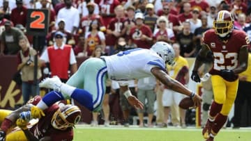 Sep 18, 2016; Landover, MD, USA; Dallas Cowboys quarterback Dak Prescott (4) scores a touchdown against the Washington Redskins during the second half at FedEx Field. The Dallas Cowboys won 27 - 23. Mandatory Credit: Brad Mills-USA TODAY Sports