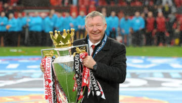 Manchester United manager Sir Alex Ferguson celebrates with the Barclays Premier League trophy, after the game (Photo by Martin Rickett/PA Images via Getty Images)