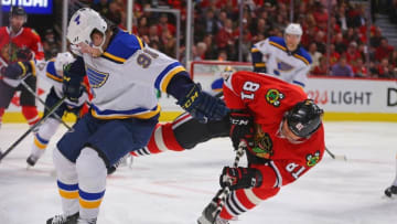 Apr 17, 2016; Chicago, IL, USA; St. Louis Blues right wing Vladimir Tarasenko (91) and Chicago Blackhawks right wing Marian Hossa (81) fight for the puck during the first period in game three of the first round of the 2016 Stanley Cup Playoffs at the United Center. Mandatory Credit: Dennis Wierzbicki-USA TODAY Sports