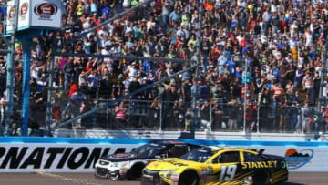 Mar 13, 2016; Avondale, AZ, USA; NASCAR Sprint Cup Series driver Kevin Harvick (4) beats Carl Edwards (19) to the finish line to win the Good Sam 500 at Phoenix International Raceway. Mandatory Credit: Mark J. Rebilas-USA TODAY Sports