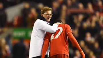 LIVERPOOL, ENGLAND - MARCH 10: Jurgen Klopp, manager of Liverpool celebrates victory with Divock Origi of Liverpool after the UEFA Europa League Round of 16 first leg match between Liverpool and Manchester United at Anfield on March 10, 2016 in Liverpool, United Kingdom. (Photo by Laurence Griffiths/Getty Images)