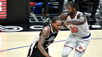 May 9, 2021; Los Angeles, California, USA; LA Clippers forward Kawhi Leonard (2) drives to the basket as New York Knicks forward Julius Randle (30) moves in to defend during the second half at Staples Center. Mandatory Credit: Robert Hanashiro-USA TODAY Sports