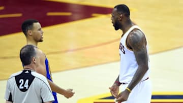 Jun 10, 2016; Cleveland, OH, USA; Golden State Warriors guard Stephen Curry (30) and Cleveland Cavaliers forward LeBron James (23) talks during the fourth quarter in game four of the NBA Finals at Quicken Loans Arena. Mandatory Credit: Bob Donnan-USA TODAY Sports