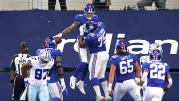 ARLINGTON, TEXAS - OCTOBER 11: Evan Engram #88 of the New York Giants is congratulated by Cameron Fleming #75 after scoring a touchdown against the Dallas Cowboys at AT&T Stadium on October 11, 2020 in Arlington, Texas. (Photo by Tom Pennington/Getty Images)