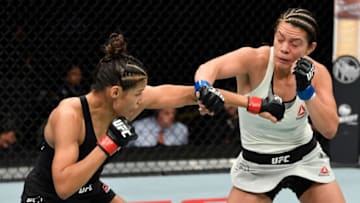 SACRAMENTO, CALIFORNIA - JULY 13: (L-R) Julianna Pena punches Nico Montano in their women's bantamweight bout during the UFC Fight Night event at Golden 1 Center on July 13, 2019 in Sacramento, California. (Photo by Jeff Bottari/Zuffa LLC/Zuffa LLC via Getty Images)