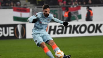 Chelsea's French forward Olivier Giroud kicks the ball before scoring a goal during the UEFA Europa League Group L football match between MOL Vidi FC and Chelsea on December 13, 2018 in Budapest. (Photo by ATTILA KISBENEDEK / AFP) (Photo credit should read ATTILA KISBENEDEK/AFP/Getty Images)