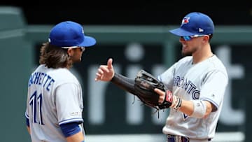 Bo Bichette #11 and Cavan Biggio #8 of the Toronto Blue Jays celebrate as the Blue Jays defeat the Kansas City Royals 4-1 to win the game at Kauffman Stadium on July 31, 2019 in Kansas City, Missouri. (Photo by Jamie Squire/Getty Images)