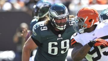 Sep 9, 2012; Cleveland, OH, USA; Philadelphia Eagles guard Evan Mathis (69) works against Cleveland Browns defensive end Juqua Parker (95) in the first quarter at Cleveland Browns Stadium. Mandatory Credit: David Richard-USA TODAY Sports