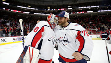 RALEIGH, NC - JANUARY 3: Goaltender Ilya Samsonov #30 of the Washington Capitals gets the victory and is congratulated by teammate Braden Holtby #70 during an NHL game against the Carolina Hurricanes on January 3, 2020 at PNC Arena in Raleigh, North Carolina. (Photo by Gregg Forwerck/NHLI via Getty Images)