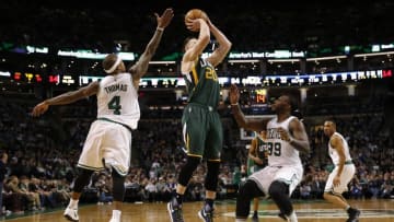 Jan 3, 2017; Boston, MA, USA; Utah Jazz guard / forward Gordon Hayward (20) takes a shot while guarded by Boston Celtics point guard Isaiah Thomas (4) and forward Jae Crowder (99) during the third quarter at TD Garden. The Boston Celtics won 115-104. Mandatory Credit: Greg M. Cooper-USA TODAY Sports