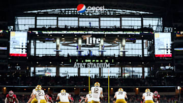ARLINGTON, TEXAS - JANUARY 01: Ian Book #12 of the Notre Dame Fighting Irish snaps the ball against the Alabama Crimson Tide during the second quarter in the 2021 College Football Playoff Semifinal Game at the Rose Bowl Game presented by Capital One at AT&T Stadium on January 01, 2021 in Arlington, Texas. (Photo by Tom Pennington/Getty Images)