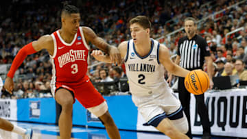 Mar 20, 2022; Pittsburgh, PA, USA; Villanova Wildcats guard Collin Gillespie (2) dribbles the ball past Ohio State Buckeyes guard Eugene Brown III (3) in the second half during the second round of the 2022 NCAA Tournament at PPG Paints Arena. Mandatory Credit: Geoff Burke-USA TODAY Sports
