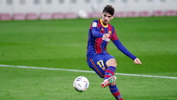 BARCELONA, SPAIN - FEBRUARY 13: Francisco Trincao of FC Barcelona shots the ball during the La Liga Santander match between FC Barcelona and Deportivo Alavés at Camp Nou on February 13, 2021 in Barcelona, Spain. Sporting stadiums around Spain remain under strict restrictions due to the Coronavirus Pandemic as Government social distancing laws prohibit fans inside venues resulting in games being played behind closed doors. (Photo by Eric Alonso/Getty Images)