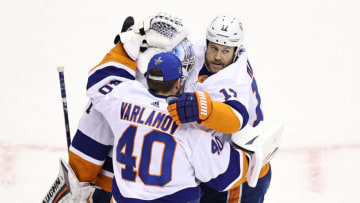 Thomas Greiss #1, Semyon Varlamov #40 and Matt Martin #17 of the New York Islanders (Photo by Elsa/Getty Images)
