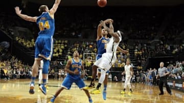 Jan 30, 2014; Eugene, OR, USA; UCLA Bruins guard/forward Kyle Anderson (5) blocks Oregon Ducks guard Johnathan Loyd (10) last shot of the game. UCLA Bruins wins 70-68 against the Oregon Ducks at Matthew Knight Arena. Mandatory Credit: Scott Olmos-USA TODAY Sports