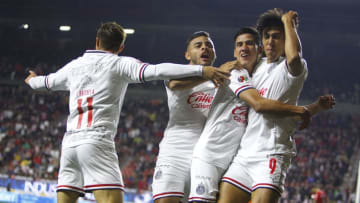 J.J. Macias (right) embraces Uriel Antuna as Isaac Brizuela (left) and Alexis Vega join in the celebration after Macías scored against Tijuana. (Photo by Gonzalo Gonzalez/Jam Media/Getty Images)