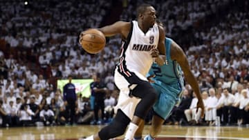 Apr 20, 2016; Miami, FL, USA; Miami Heat forward Luol Deng (9) dribbles the ball past Charlotte Hornets forward Marvin Williams (2) in game two of the first round of the NBA Playoffs during the second quarter at American Airlines Arena. Mandatory Credit: Steve Mitchell-USA TODAY Sports