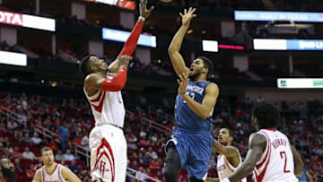 Mar 18, 2016; Houston, TX, USA; Minnesota Timberwolves center Karl-Anthony Towns (32) shoots the ball over Houston Rockets center Dwight Howard (12) during the second half at Toyota Center. The Rockets won 116-111. Mandatory Credit: Troy Taormina-USA TODAY Sports