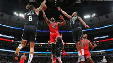 CHICAGO, ILLINOIS - FEBRUARY 25: Wayne Selden #14 of the Chicago Bulls drives between D.J. Wilson #5 and Bonzie Colson #50 of the Milwaukee Bucks at the United Center on February 25, 2019 in Chicago, Illinois. The Bucks defeated the Bulls 117-106. NOTE TO USER: User expressly acknowledges and agrees that, by downloading and or using this photograph, User is consenting to the terms and conditions of the Getty Images License Agreement. (Photo by Jonathan Daniel/Getty Images)