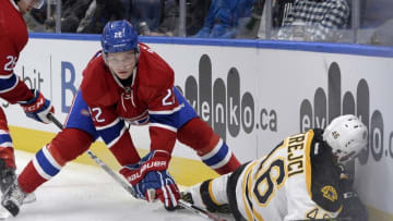 Oct 4, 2016; Quebec City, Quebec, CAN; Montreal Canadiens defenseman Mikhail Sergachev (22) checks Boston Bruins forward David Krejci (46) during the third period of a preseason hockey game at Centre Videotron. Mandatory Credit: Eric Bolte-USA TODAY Sports