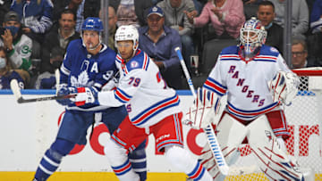 TORONTO, ON - OCTOBER 18: K'Andre Miller #79 of the New York Rangers battles Auston Matthews #34 of the Toronto Maple Leafs for position in front of the net at Scotiabank Arena on October 18, 2021 in Toronto, Ontario, Canada. (Photo by Claus Andersen/Getty Images)