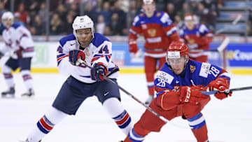 TORONTO, ON - DECEMBER 26: Erik Foley #14 of Team USA tries to hold up Yegor Rykov #28 of Team Russia during a preliminary game at the 2017 IIHF World Junior Hockey Championship at the Air Canada Centre on December 29, 2016 in Toronto, Ontario, Canada. Team USA defeated Team Russia 3-2. (Photo by Claus Andersen/Getty Images)