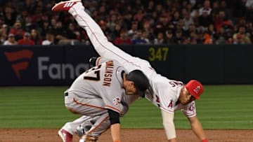 ANAHEIM, CA - APRIL 20: Andrelton Simmons #2 of the Los Angeles Angels of Anaheim us upended by Kelby Tomlinson #37 of the San Francisco Giants at he completes a double play in the third inning of the game at Angel Stadium of Anaheim on April 20, 2018 in Anaheim, California. (Photo by Jayne Kamin-Oncea/Getty Images)