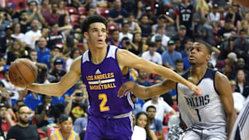 LAS VEGAS, NV - JULY 16: Lonzo Ball #2 of the Los Angeles Lakers looks to pass the ball as he drives against Dennis Smith Jr. #1 of the Dallas Mavericks during a semifinal game of the 2017 Summer League at the Thomas & Mack Center on July 16, 2017 in Las Vegas, Nevada. Los Angeles won 108-98. NOTE TO USER: User expressly acknowledges and agrees that, by downloading and or using this photograph, User is consenting to the terms and conditions of the Getty Images License Agreement. (Photo by Ethan Miller/Getty Images)