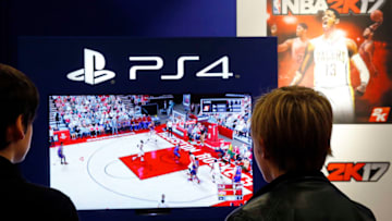 PARIS, FRANCE - OCTOBER 27: Visitors play the video game 'NBA 2K 17' developed byVisual Concepts and published by 2K Sports on Sony PlayStation game console PS4 during the 'Paris Games Week'on October 27, 2016 in Paris, France. 'Paris Games Week' is an international trade fair for video games to be held from October 27 to October 31, 2016. (Photo by Chesnot/Getty Images)